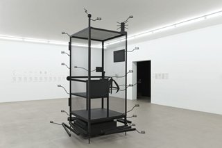 workers cage by Simon Denny